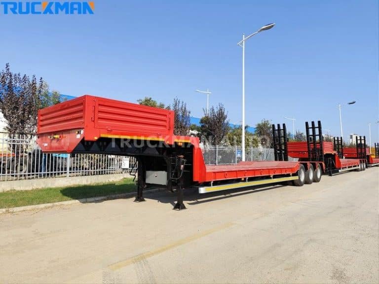 Low bed semi-trailers are designed as flatbeds, suitable for carrying oversized loads, with reinforced frames and multiple wheels.