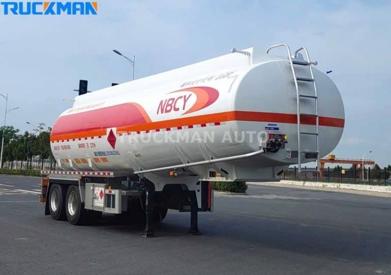 TRUCKMAN AUTO aluminum fuel tanker trailer parked on a concrete lot showcasing the rear valves and safety features with NBCY branding