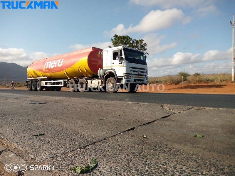 Tanker truck loaded with liquid cargo travelling on the road