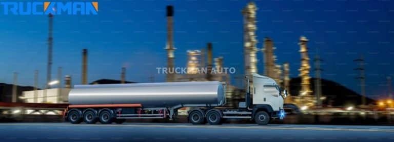 Tank trailers from TRUCKMAN equipped with advanced safety devices, including emergency shut-off and overflow prevention valves, parked at an industrial oil plant