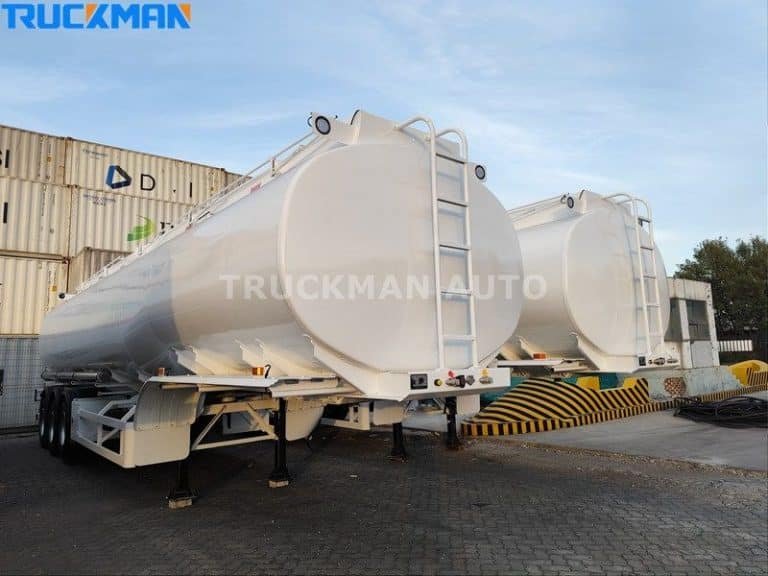 fuel tanker trailer manufactured by TRUCKMAN AUTO parked at a container terminal