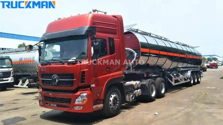 A red tractor head pulling a TRUCKMAN AUTO fuel tanker trailer, representing the integration of powerful vehicles for efficient fuel delivery.