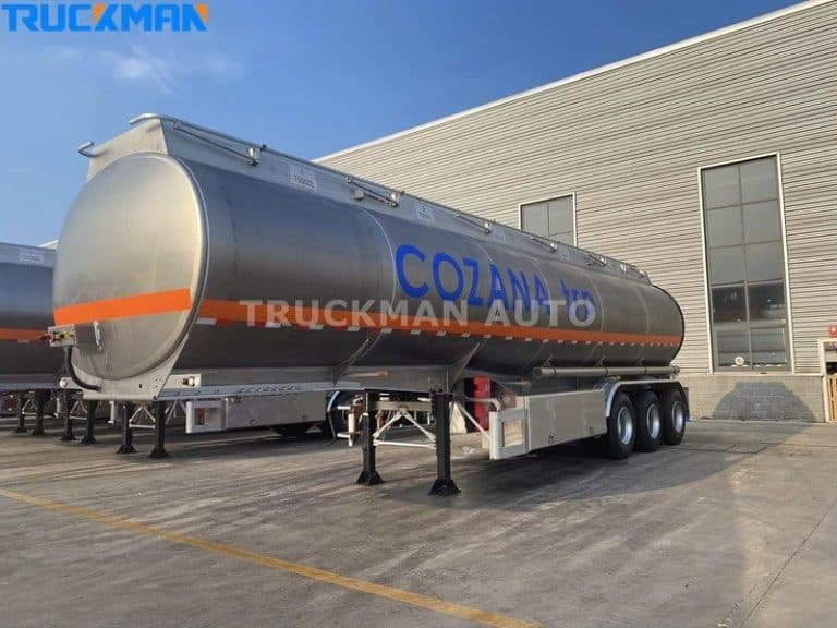 TRUCKMAN AUTO aluminum fuel tanker trailer with COZANA branding, featuring a shiny tank and heavy-duty tires, ready for transport.