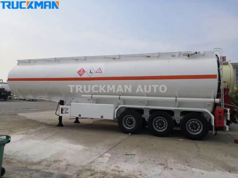 Truckman Auto's white tanker trailer for flammable liquids, with side-mounted safety ladders