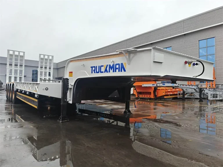 4 line 8 axle lowbed trailer with fixed gooseneck, front three-quarter view